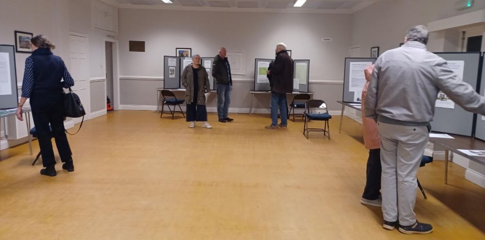Attendees at the Winterton Hall N P drop in event looking at board displays.